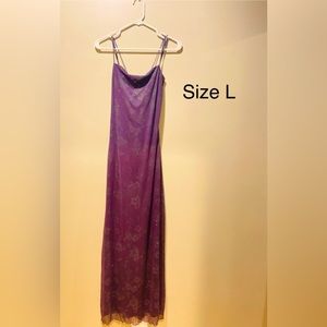Large open cowl string back sleek evening gown.